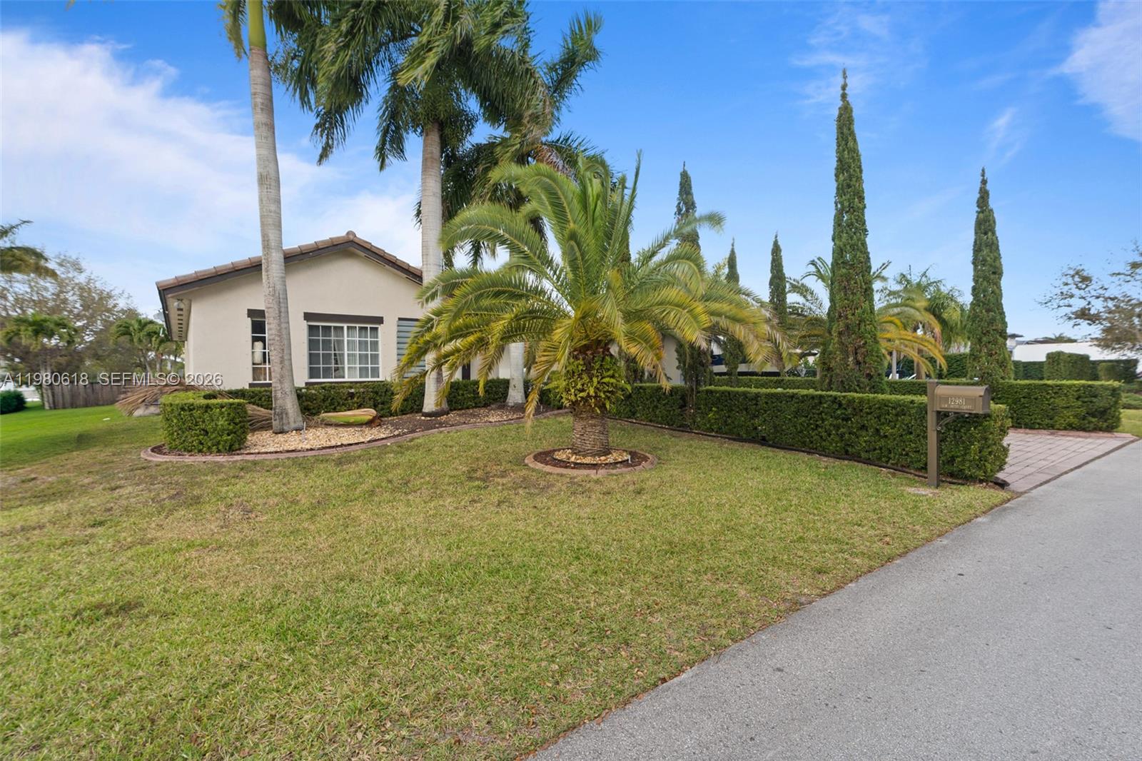12981 Southwest 197th Street Miami, FL 33177 - Photo 64 of 75 a view of a yard with palm trees
