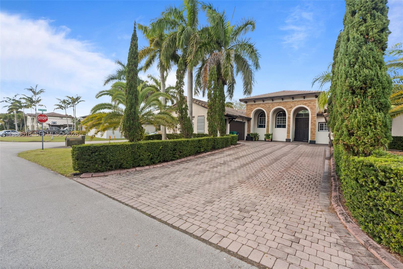 12981 Southwest 197th Street Miami, FL 33177 - Photo 66 of 75 front view of a house with a garden