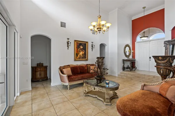 a kitchen with stainless steel appliances granite countertop a sink a stove and refrigerator