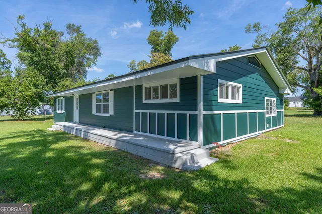 front view of a house with a yard