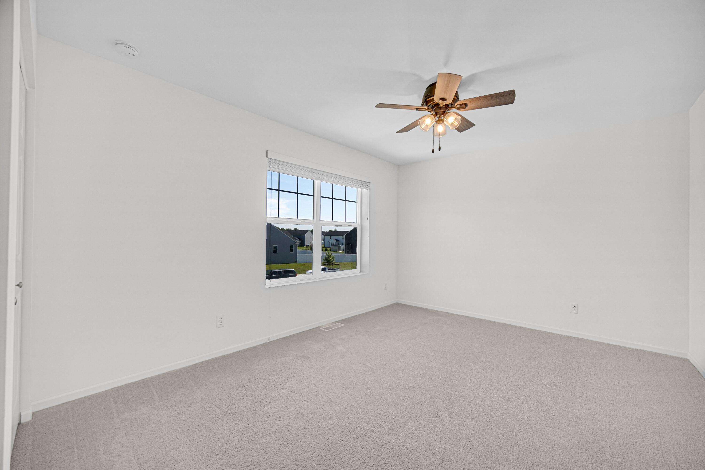 5710 Burr Rdg Circle Crown Point, IN 46307 - Photo 24 of 35 an empty room with windows and fan