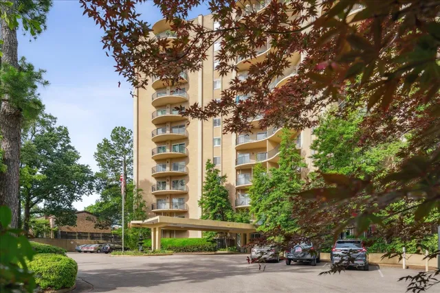 a couple of cars parked in front of a house
