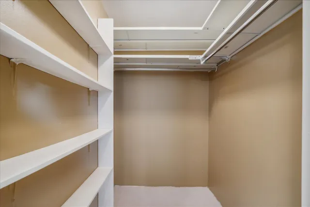 a view of an empty walk in closet