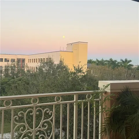 a view of a balcony with an ocean view