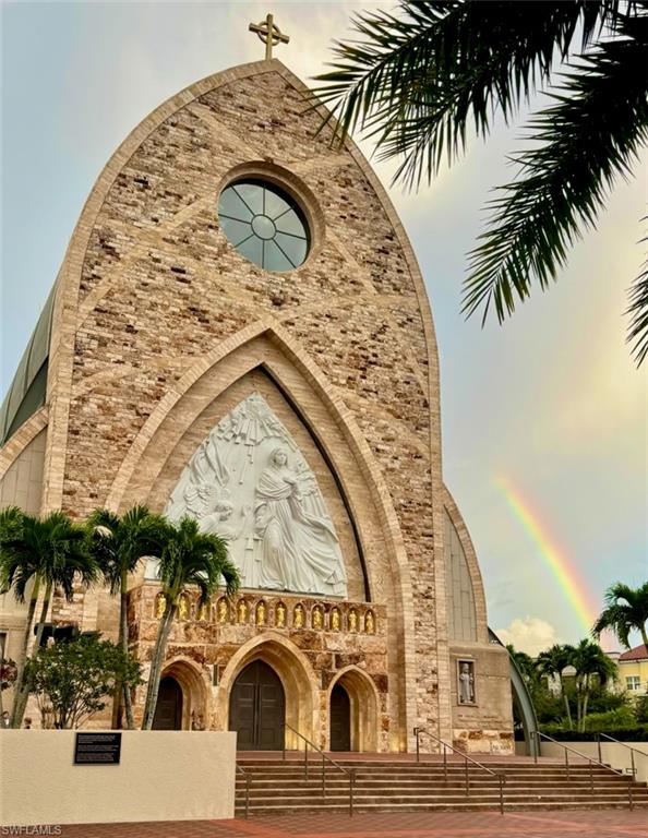 5080 Annunciation Circle, Unit 1306 Ave Maria, FL 34142 - Photo 4 of 6 an outdoor view with swimming pool