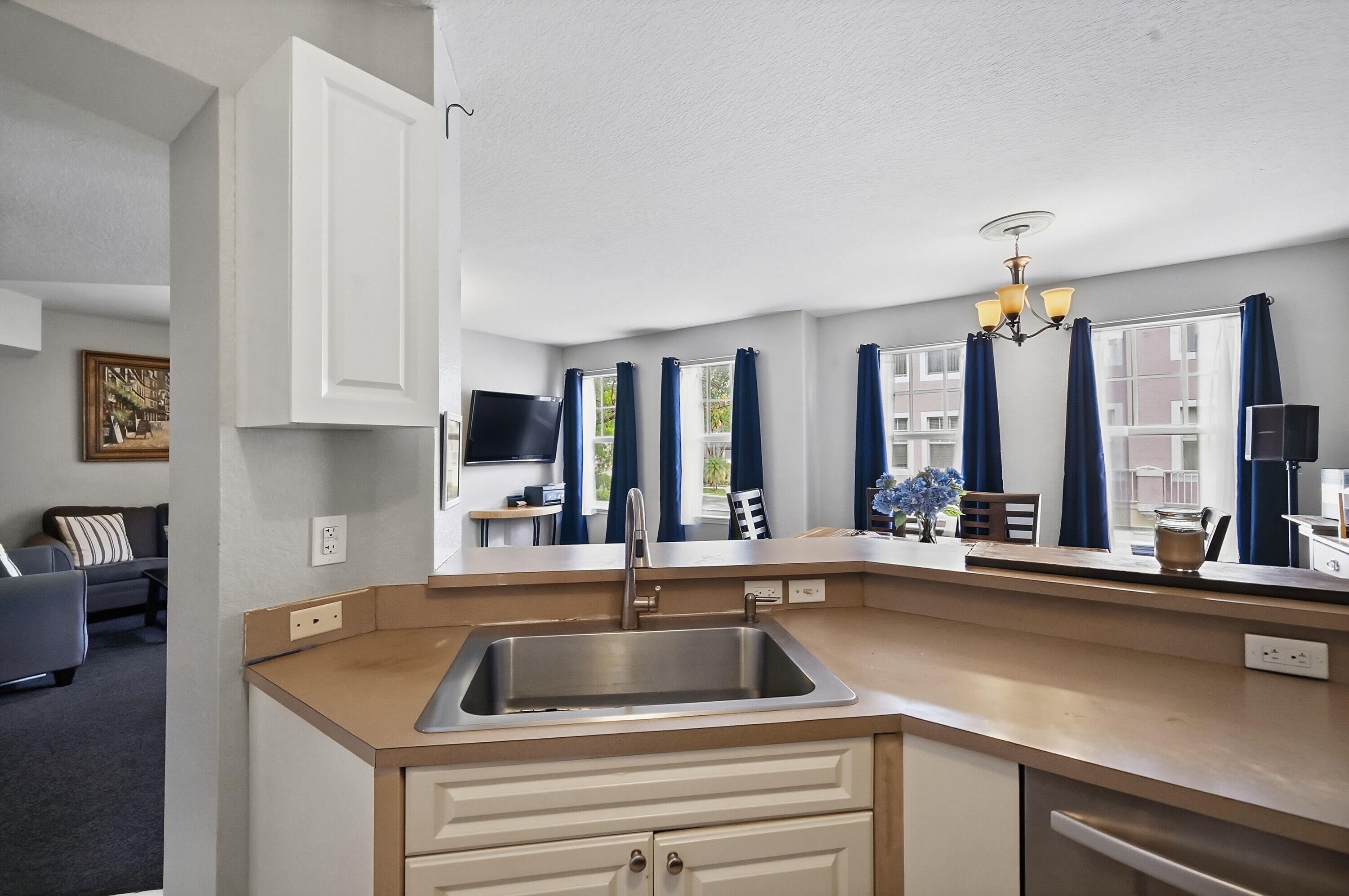6450 West Sample Road, Unit 6450 Coral Springs, FL 33067 - Photo 12 of 41 a kitchen with a sink and a refrigerator