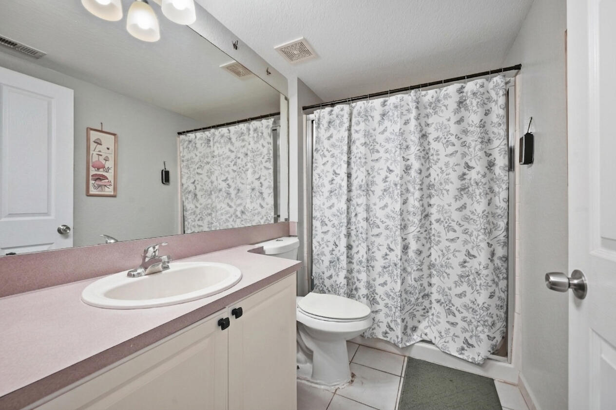 6450 West Sample Road, Unit 6450 Coral Springs, FL 33067 - Photo 16 of 41 a bathroom with a sink toilet and shower