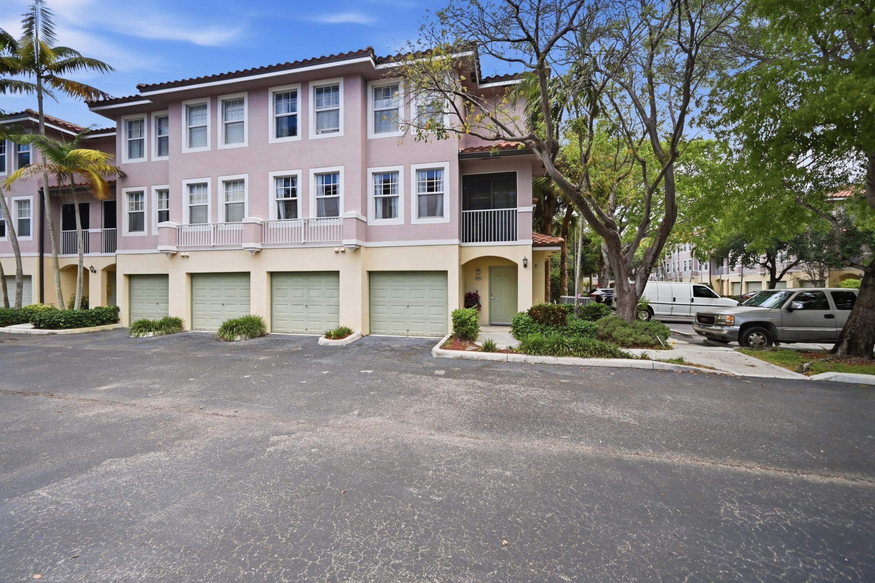 6450 West Sample Road, Unit 6450 Coral Springs, FL 33067 - Photo 2 of 41 a front view of a building with street view