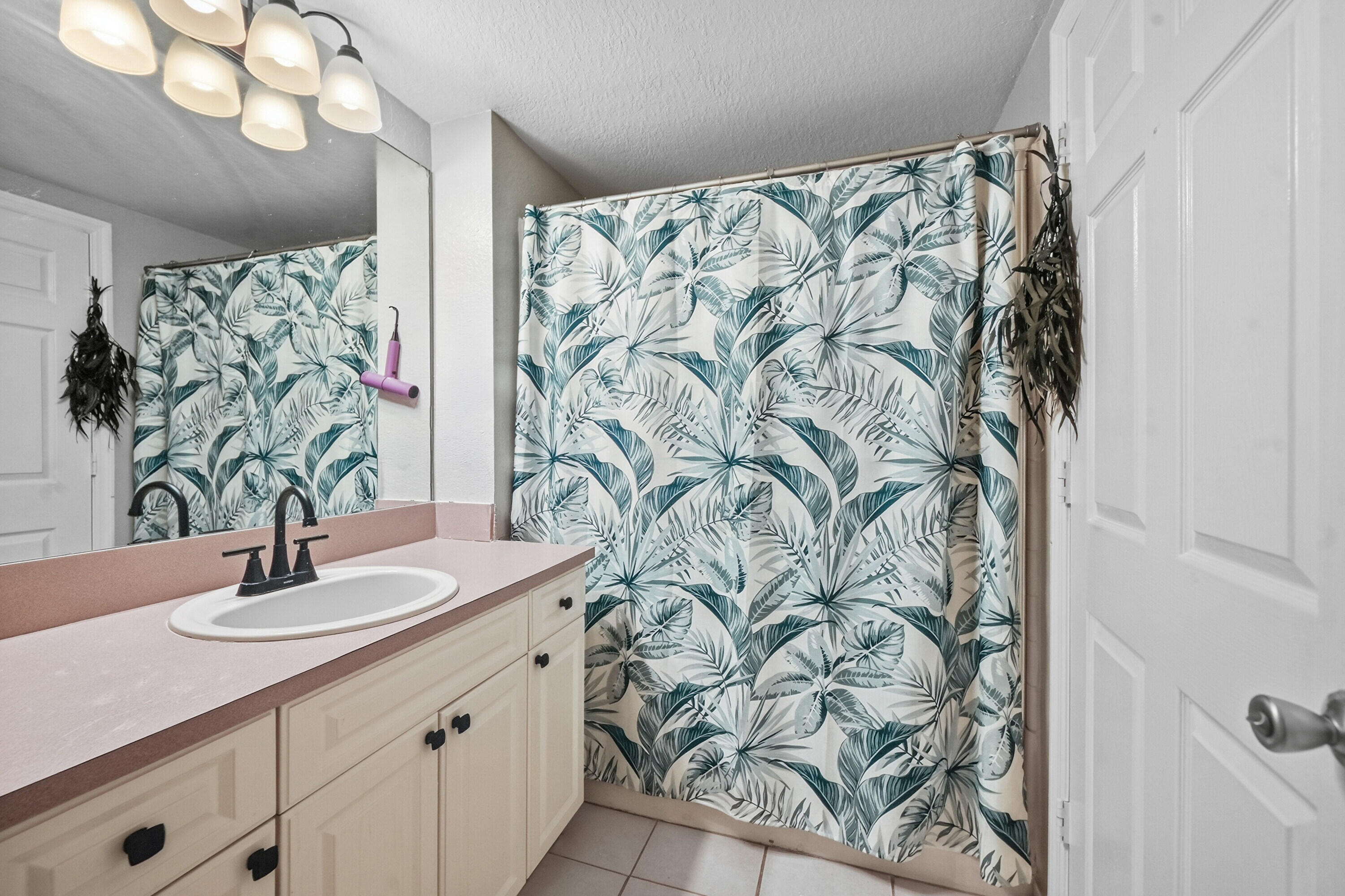 6450 West Sample Road, Unit 6450 Coral Springs, FL 33067 - Photo 24 of 41 a bathroom with a sink and a mirror