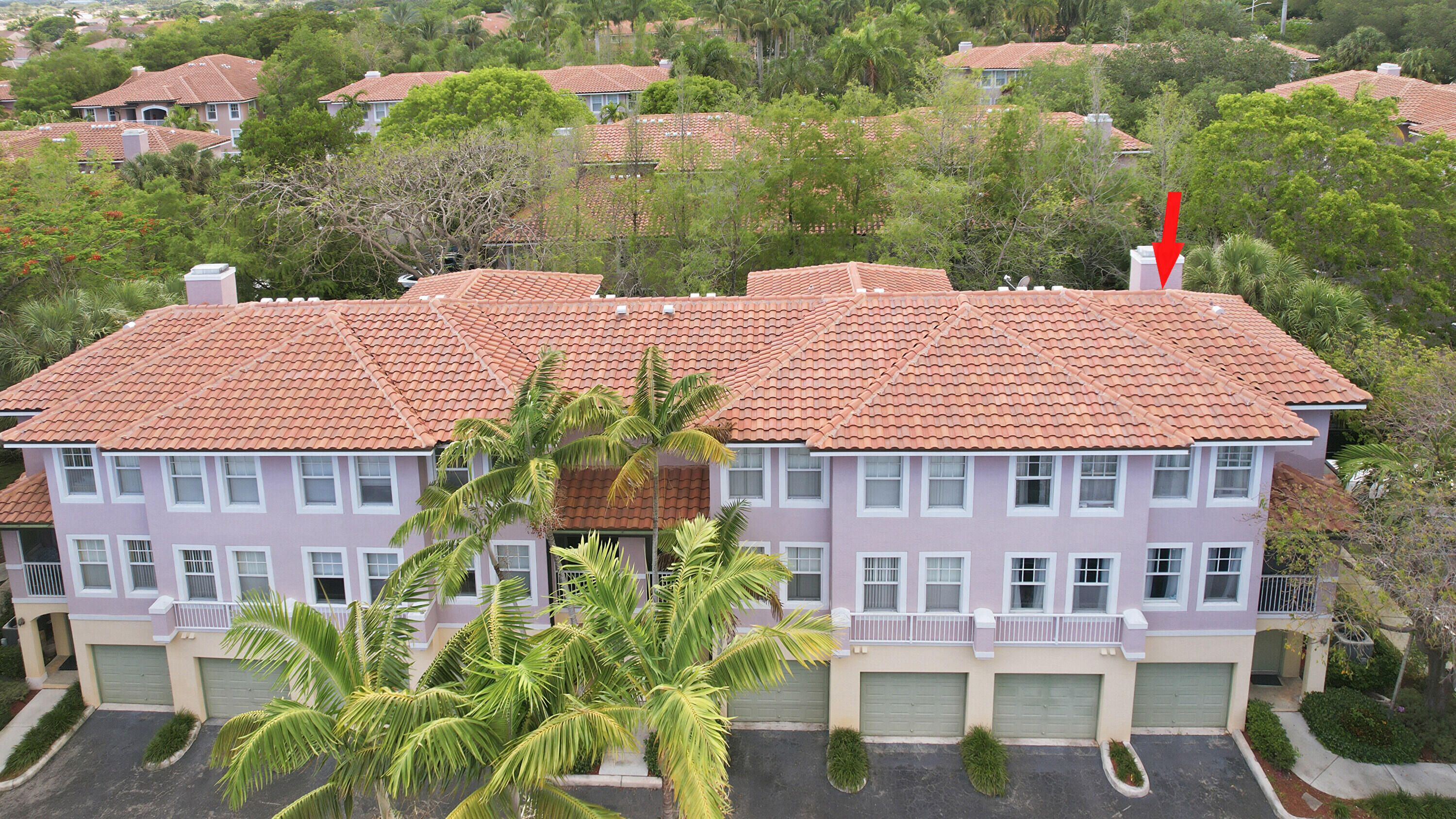 6450 West Sample Road, Unit 6450 Coral Springs, FL 33067 - Photo 27 of 41 a view of a house with a yard and potted plants