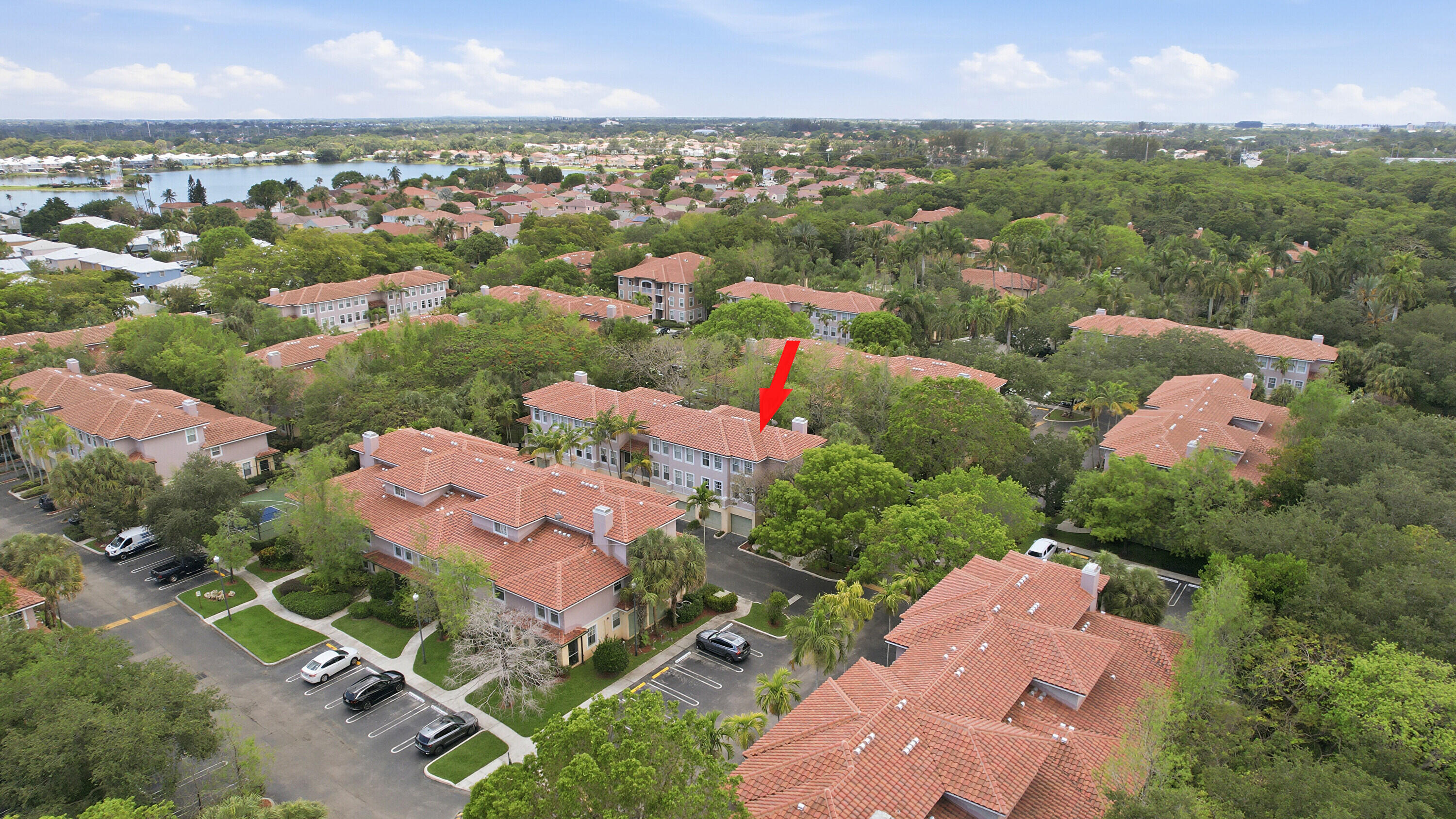 6450 West Sample Road, Unit 6450 Coral Springs, FL 33067 - Photo 30 of 41 an aerial view of a city with lots of residential buildings ocean and mountain view in back