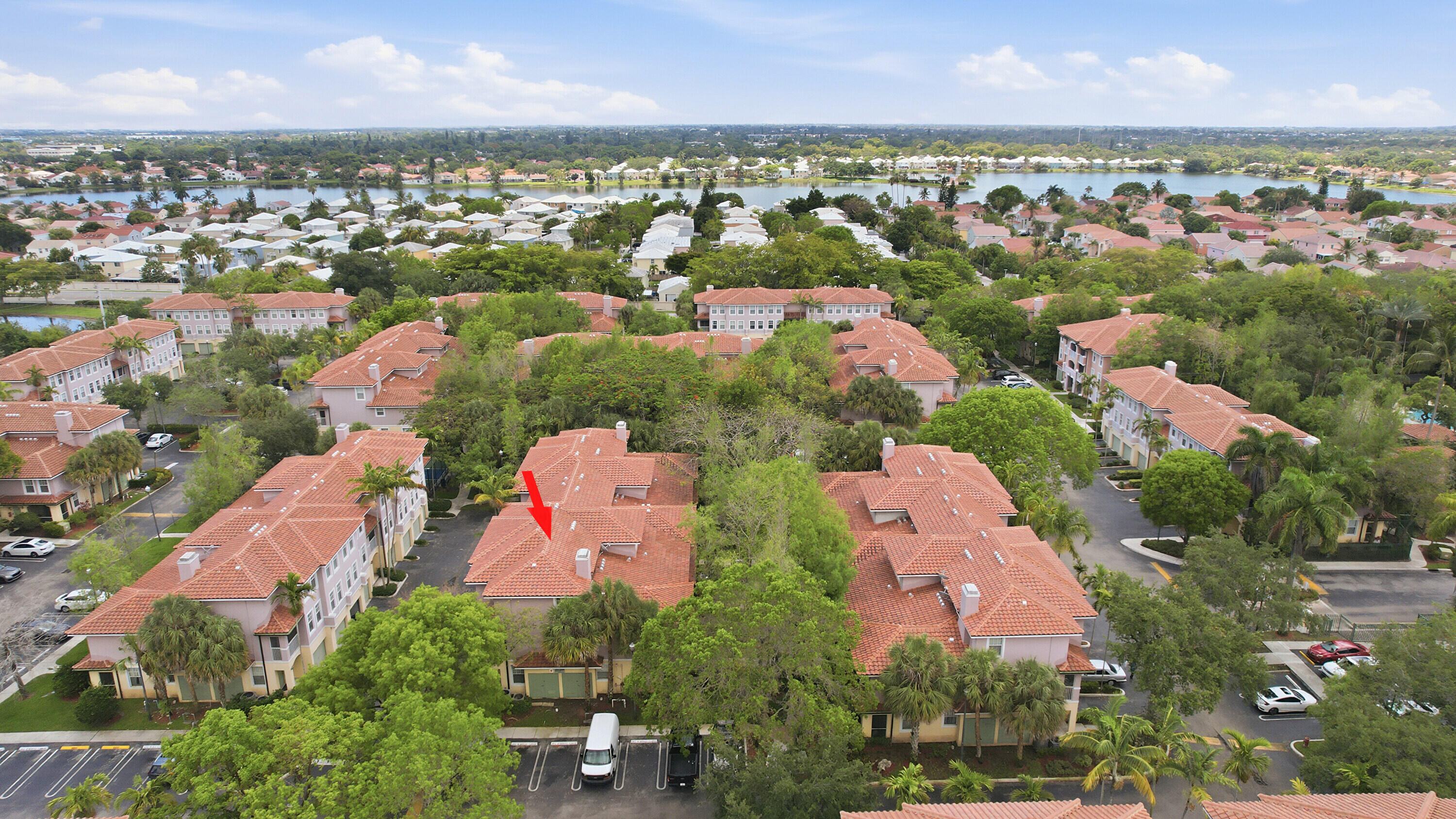 6450 West Sample Road, Unit 6450 Coral Springs, FL 33067 - Photo 31 of 41 an aerial view of a city with lots of residential buildings ocean and mountain view in back