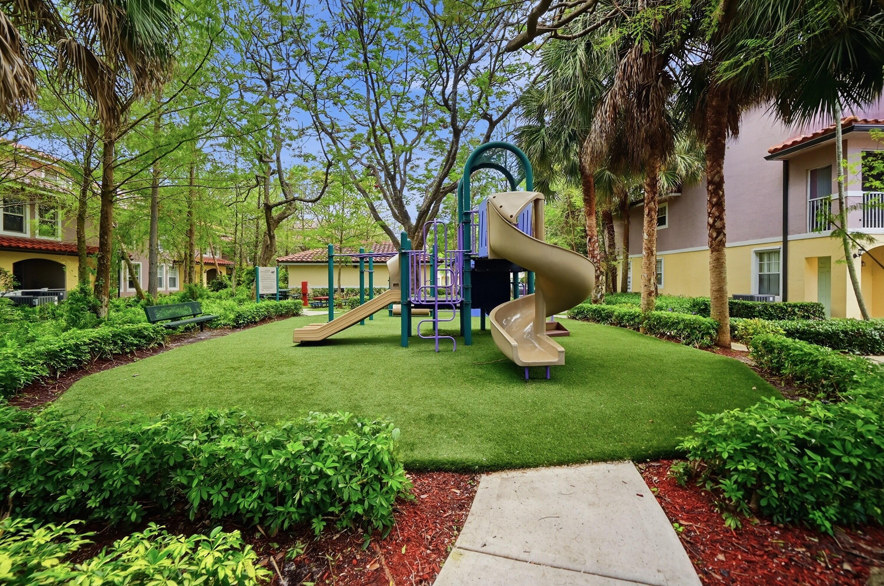 6450 West Sample Road, Unit 6450 Coral Springs, FL 33067 - Photo 41 of 41 a view of a chair and table in the garden