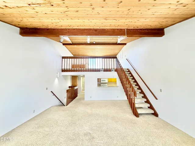 a kitchen with a sink a stove and a window