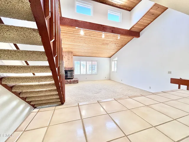 a view of a bathroom with a tub and shower