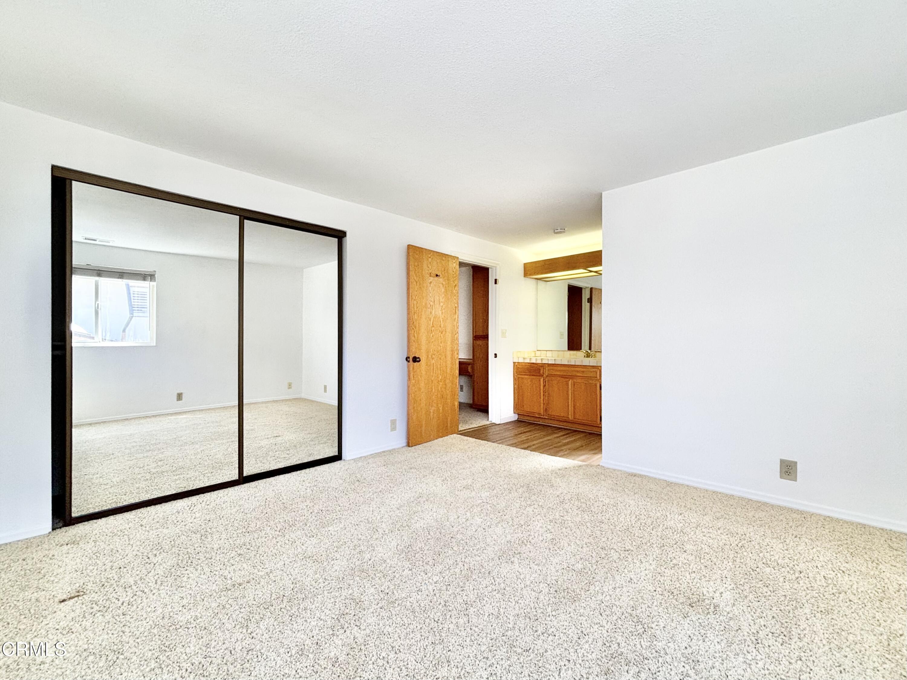 272 Cahuenga Drive Oxnard, CA 93035 - Photo 27 of 39 an empty room with closet and mirror