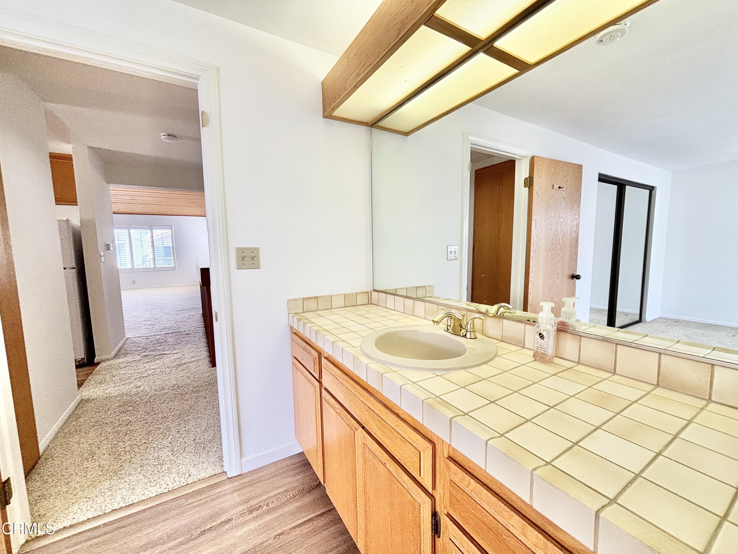 272 Cahuenga Drive Oxnard, CA 93035 - Photo 29 of 39 a bathroom with a double vanity sink and mirror