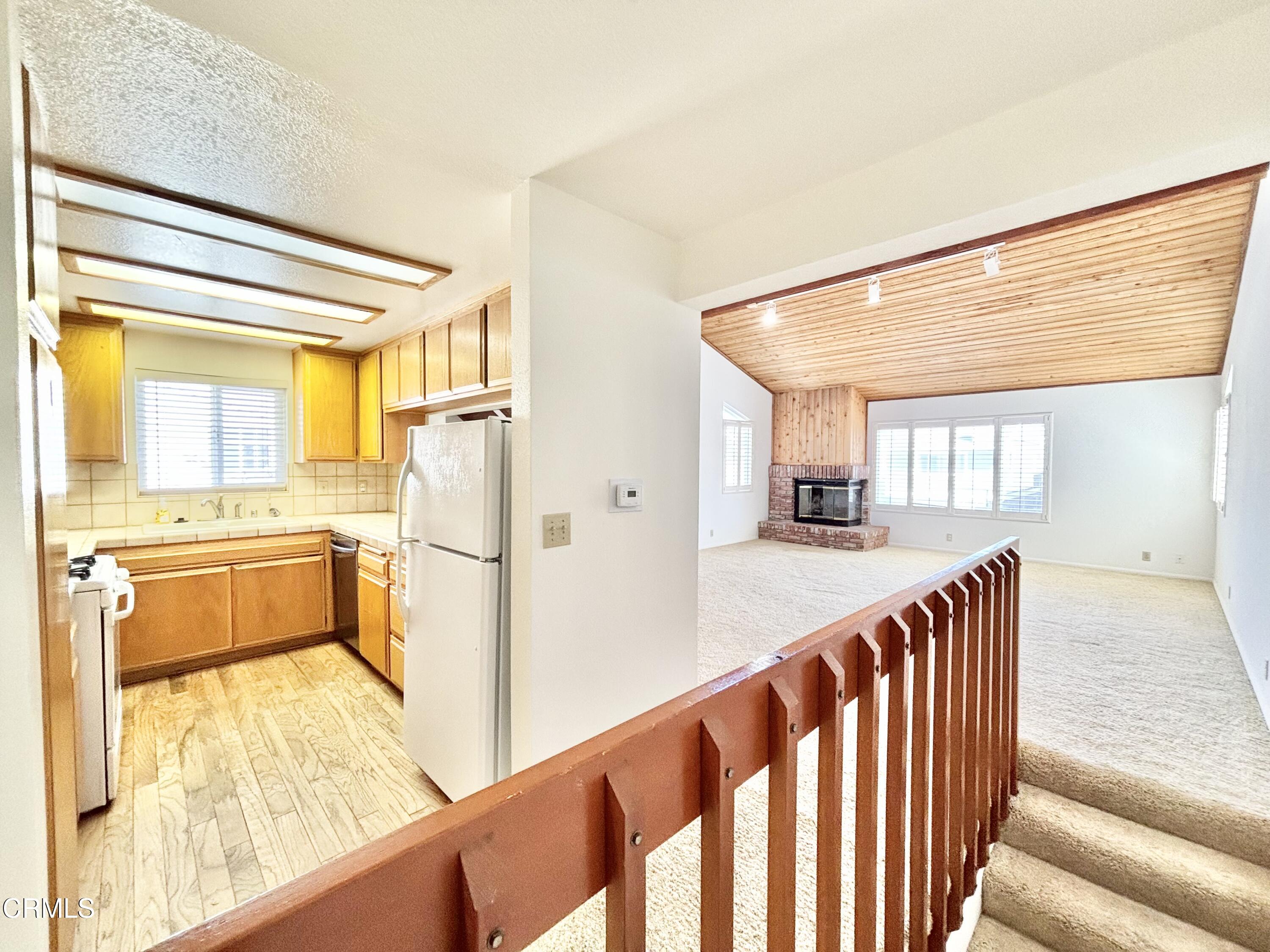272 Cahuenga Drive Oxnard, CA 93035 - Photo 30 of 39 a view of a kitchen with wooden floor and a sink