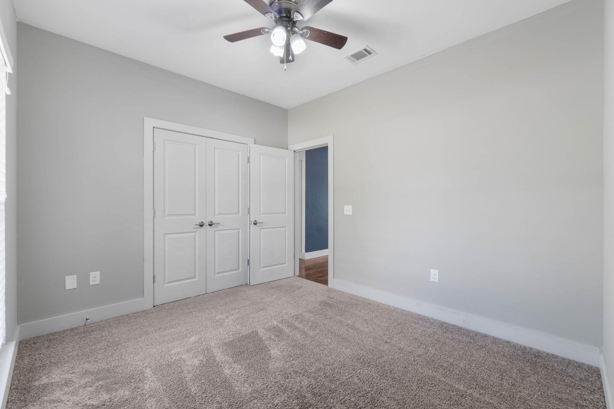 4464 Goldfinch Way Crestview, FL 32539 - Photo 19 of 31 a view of an empty room and chandelier fan