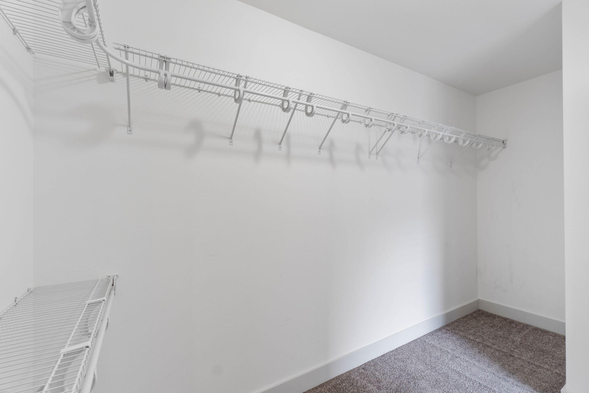 4464 Goldfinch Way Crestview, FL 32539 - Photo 26 of 31 a view of a room with racks on the wall