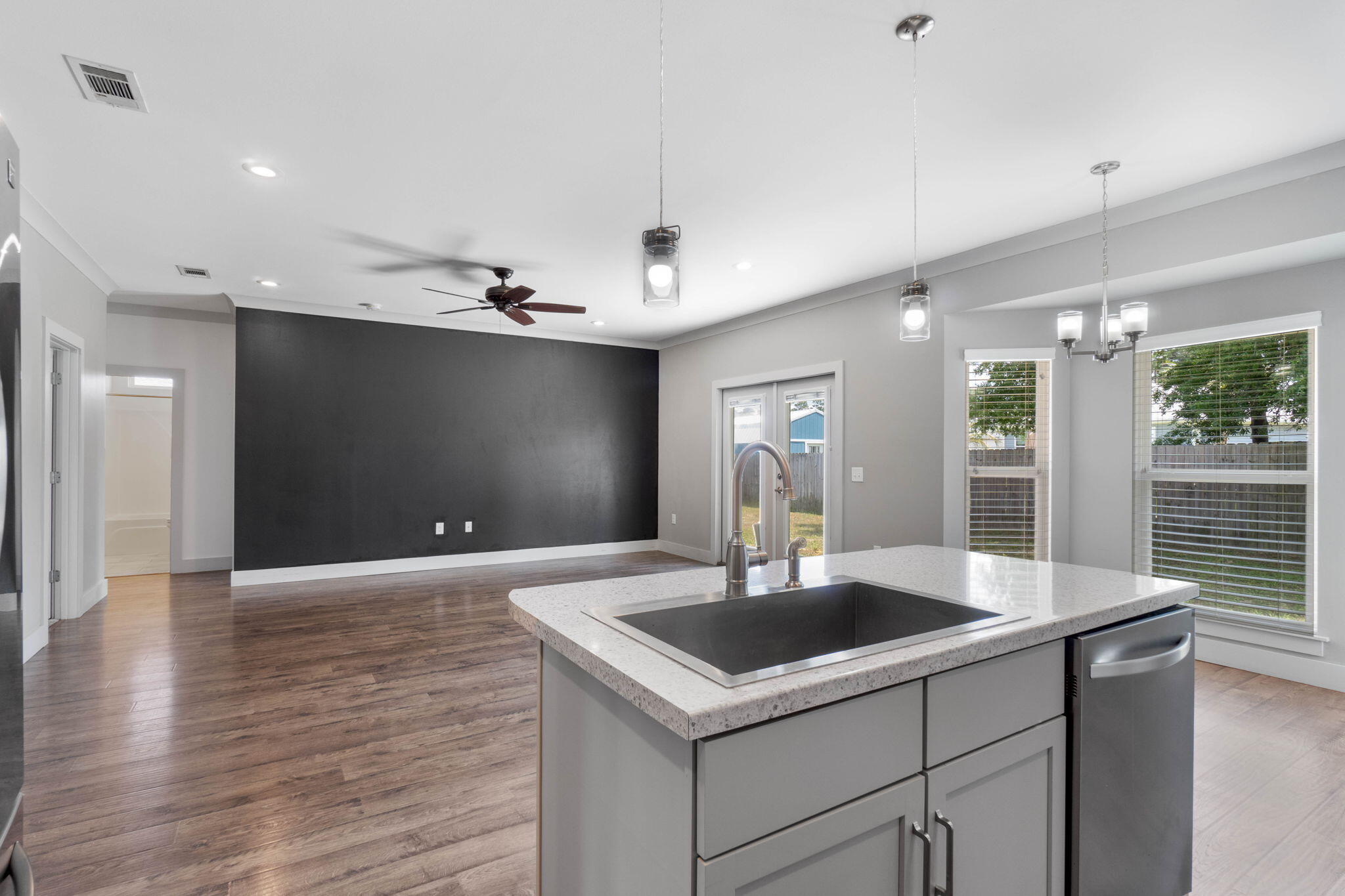 4464 Goldfinch Way Crestview, FL 32539 - Photo 10 of 31 a kitchen with a sink and chandelier