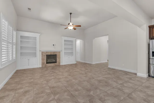 an empty room with fireplace