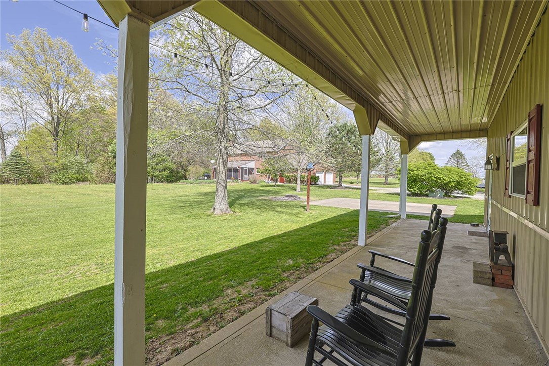 1757 Phillips Road Lebanon, OH 45036 - Photo 38 of 51 This inviting patio offers a serene outdoor space overlooking a sprawling, verdant yard.
