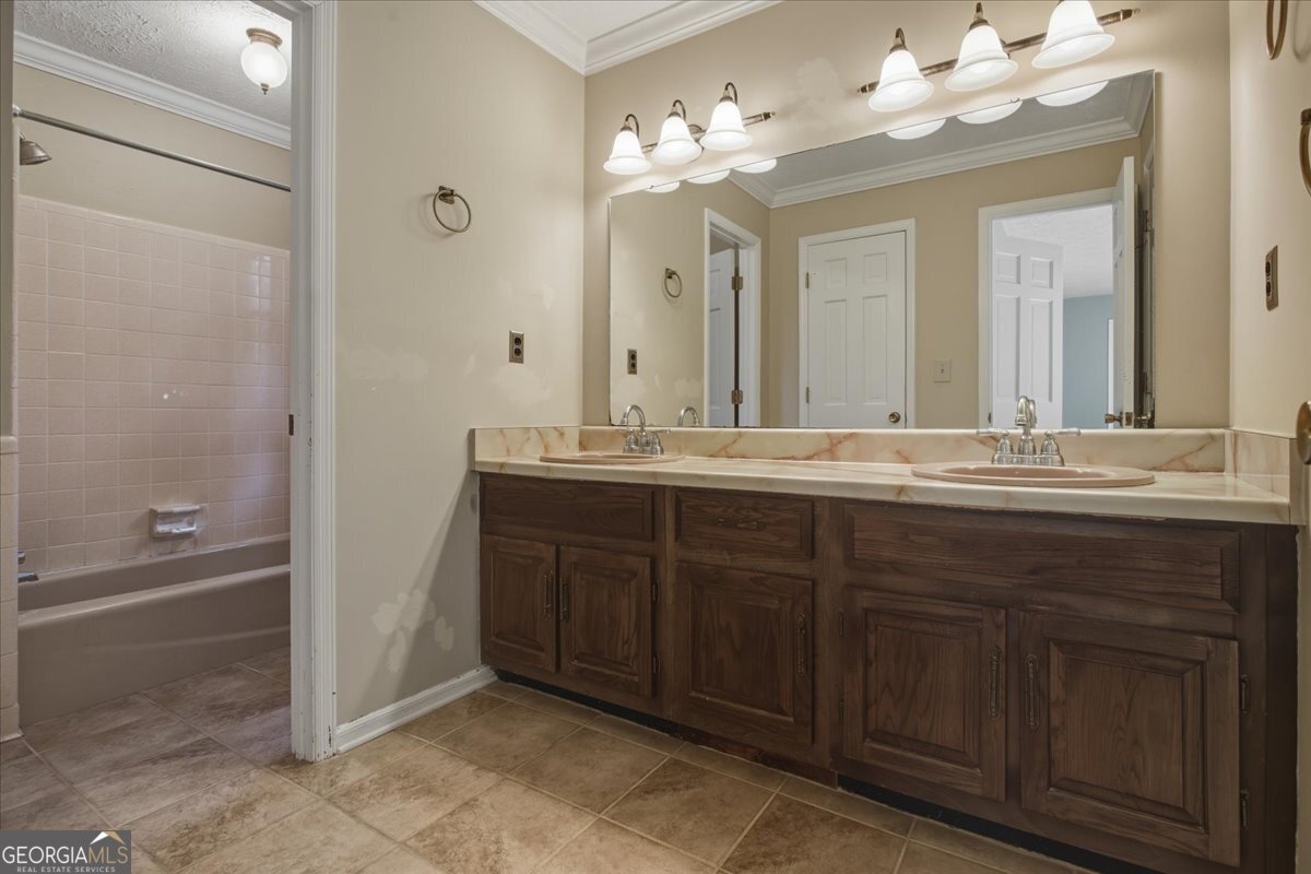 590 South New Salem Road Griffin, GA 30223 - Photo 22 of 52 a bathroom with a double vanity sink and a mirror