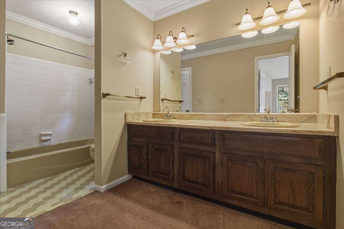 590 South New Salem Road Griffin, GA 30223 - Photo 26 of 52 a bathroom with a double vanity sink mirror and double