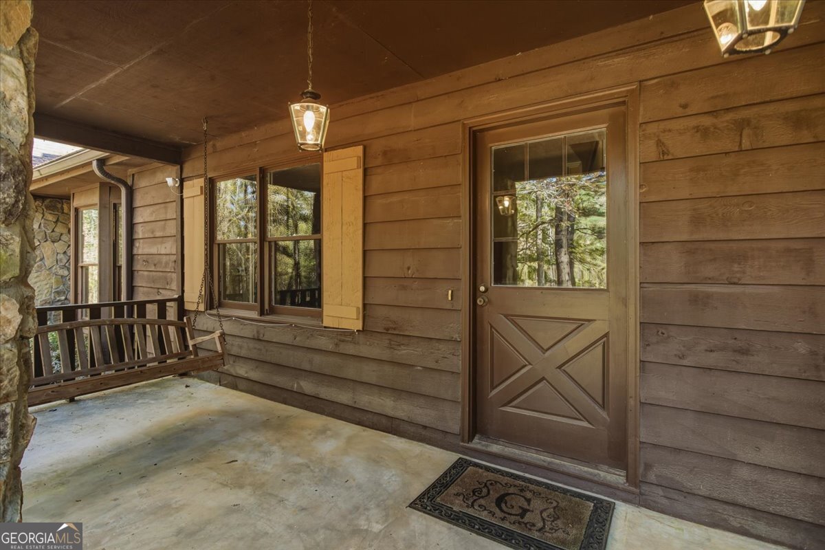 590 South New Salem Road Griffin, GA 30223 - Photo 4 of 52 a view of a porch with wooden floor and stairs