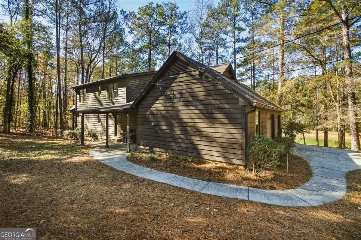 590 South New Salem Road Griffin, GA 30223 - Photo 41 of 52 a view of a house with a yard