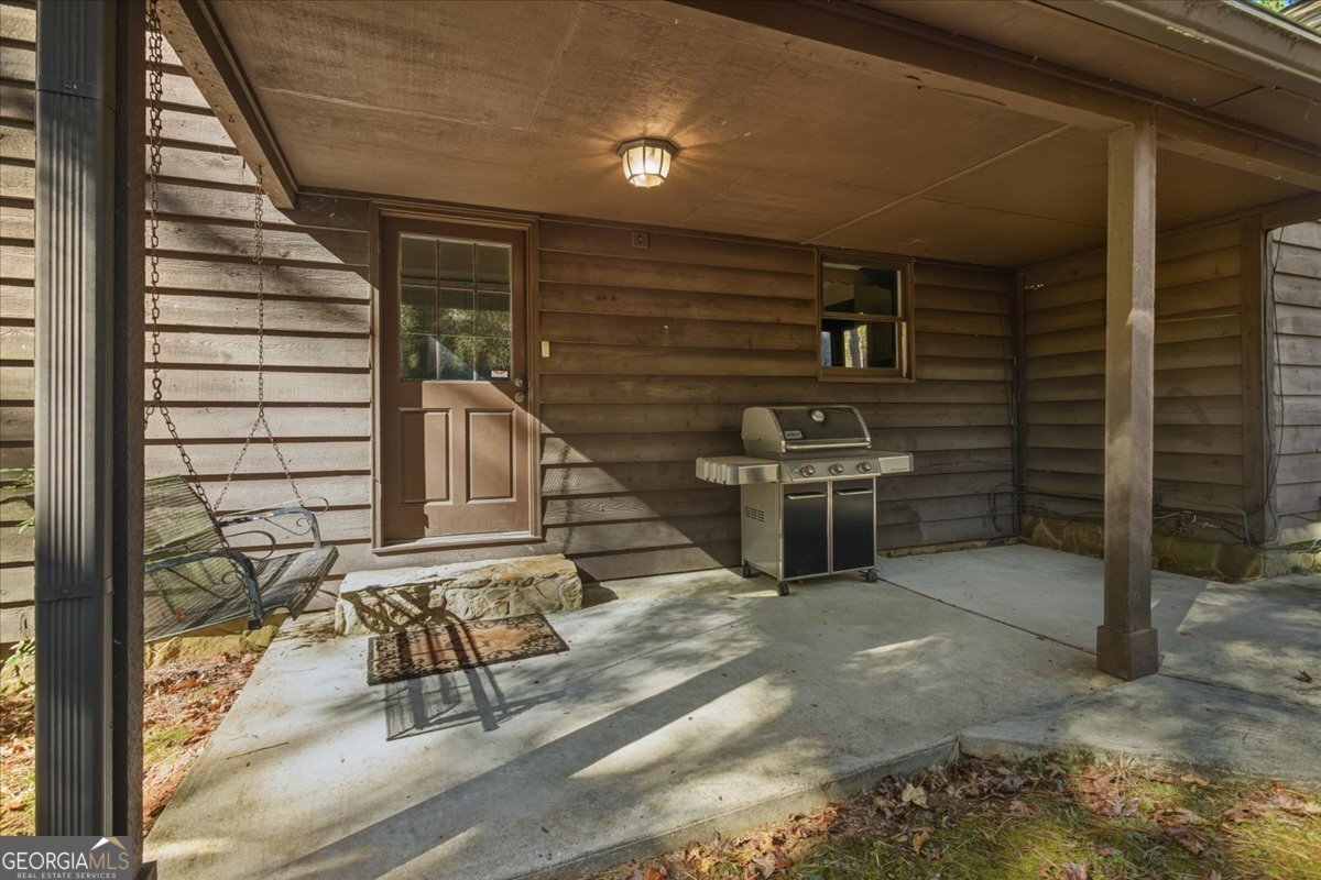 590 South New Salem Road Griffin, GA 30223 - Photo 42 of 52 a view of a porch with a bench