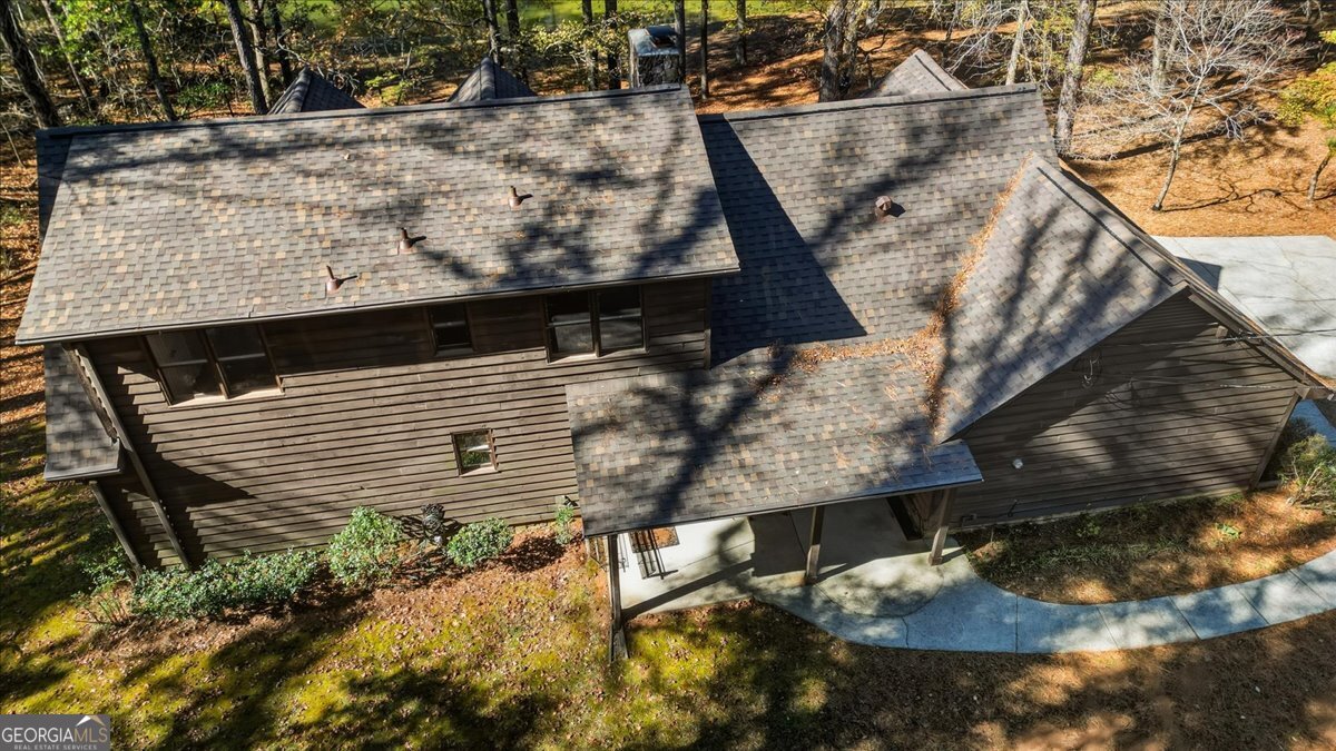 590 South New Salem Road Griffin, GA 30223 - Photo 48 of 52 a house with tall trees in the background