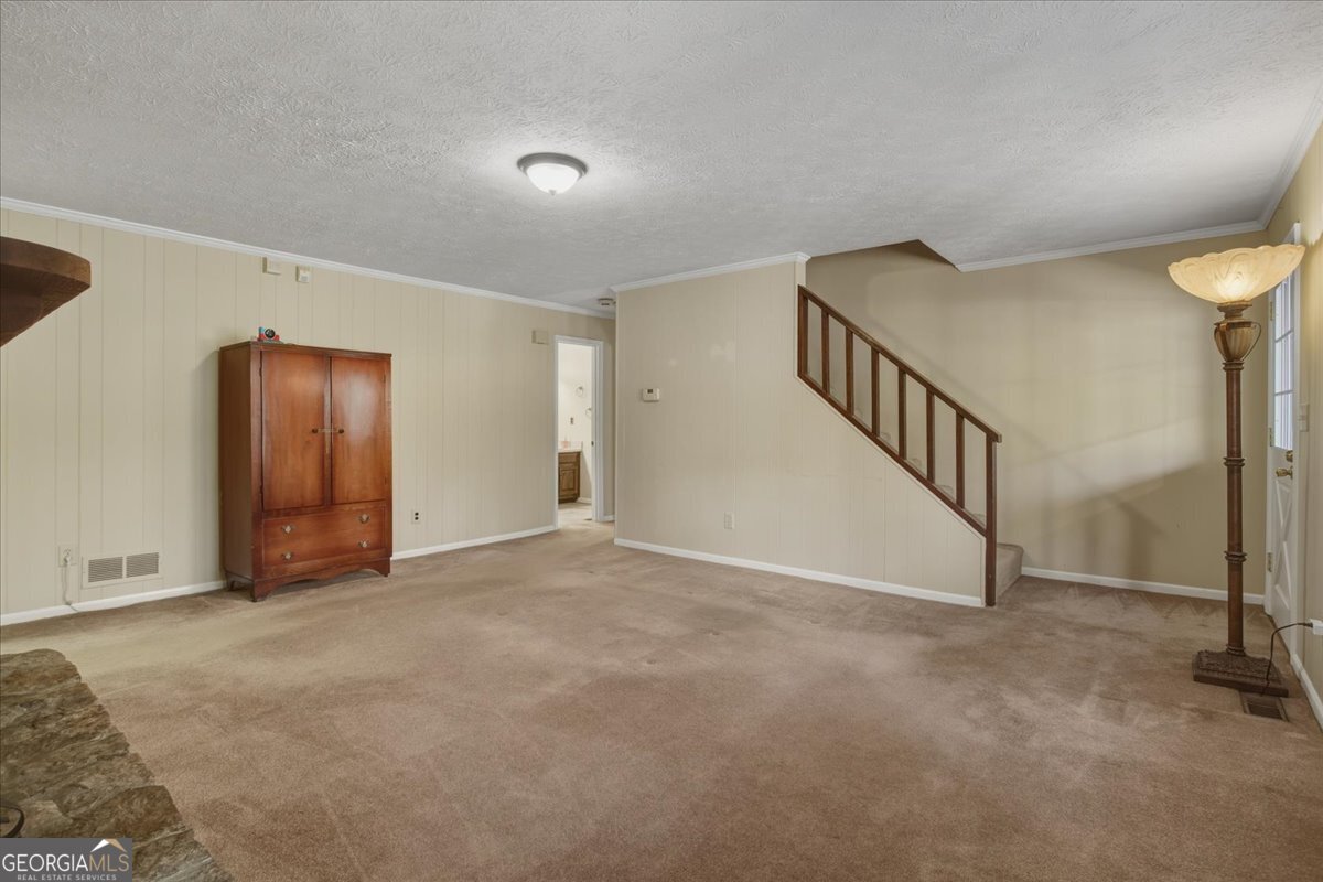 590 South New Salem Road Griffin, GA 30223 - Photo 6 of 52 a view of an empty room with stairs