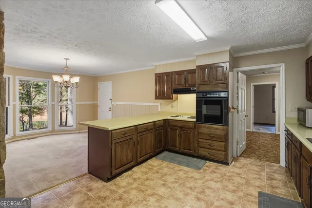a kitchen with stainless steel appliances granite countertop a stove and a sink