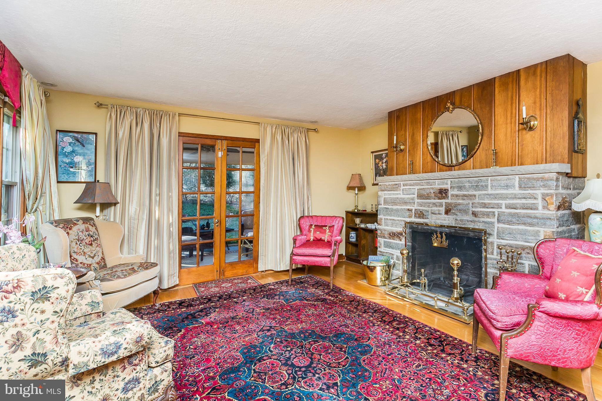 1316 Doves Cove Road Towson, MD 21286 - Photo 5 of 30 Living Room w/hardwood floor & stone fireplace