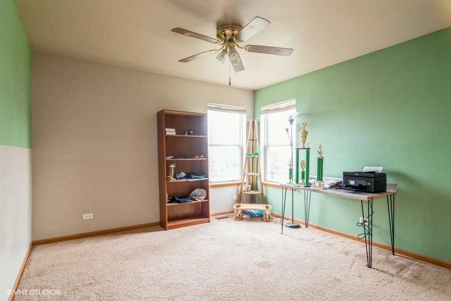 384 Kensington Drive Oswego, IL 60543 - Photo 13 of 15 a view of work space with furniture and a fan