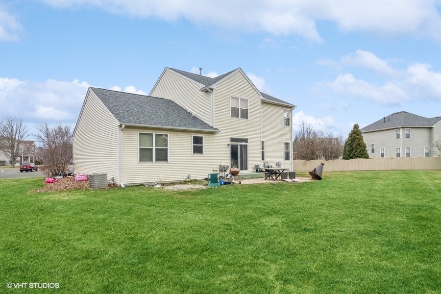 384 Kensington Drive Oswego, IL 60543 - Photo 15 of 15 a view of a house with a yard and sitting area