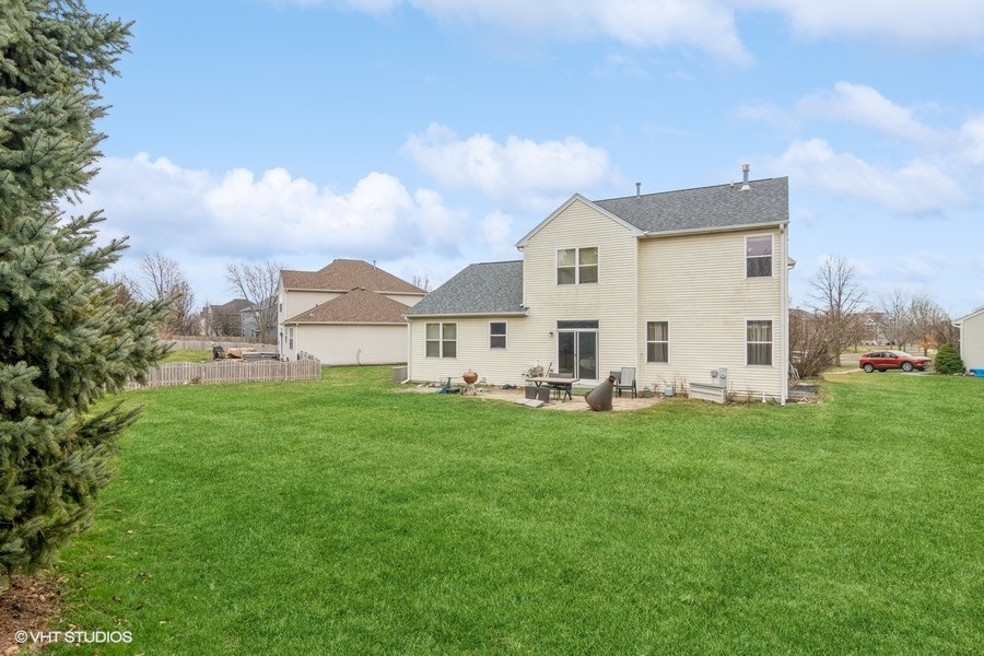 384 Kensington Drive Oswego, IL 60543 - Photo 2 of 15 a view of a house with backyard and garden