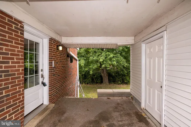 a view of a door and wooden floor