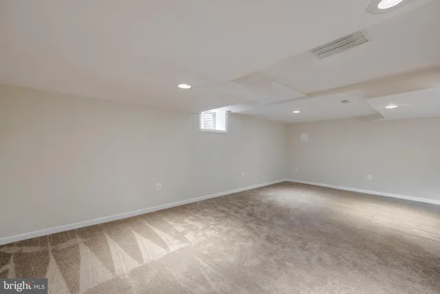 an empty room with a empty space and window