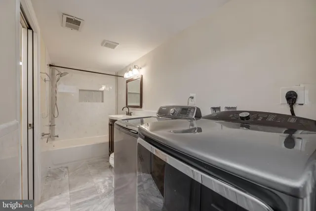 a bathroom with a sink and mirror