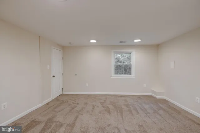 a view of a big room with windows and cabinet