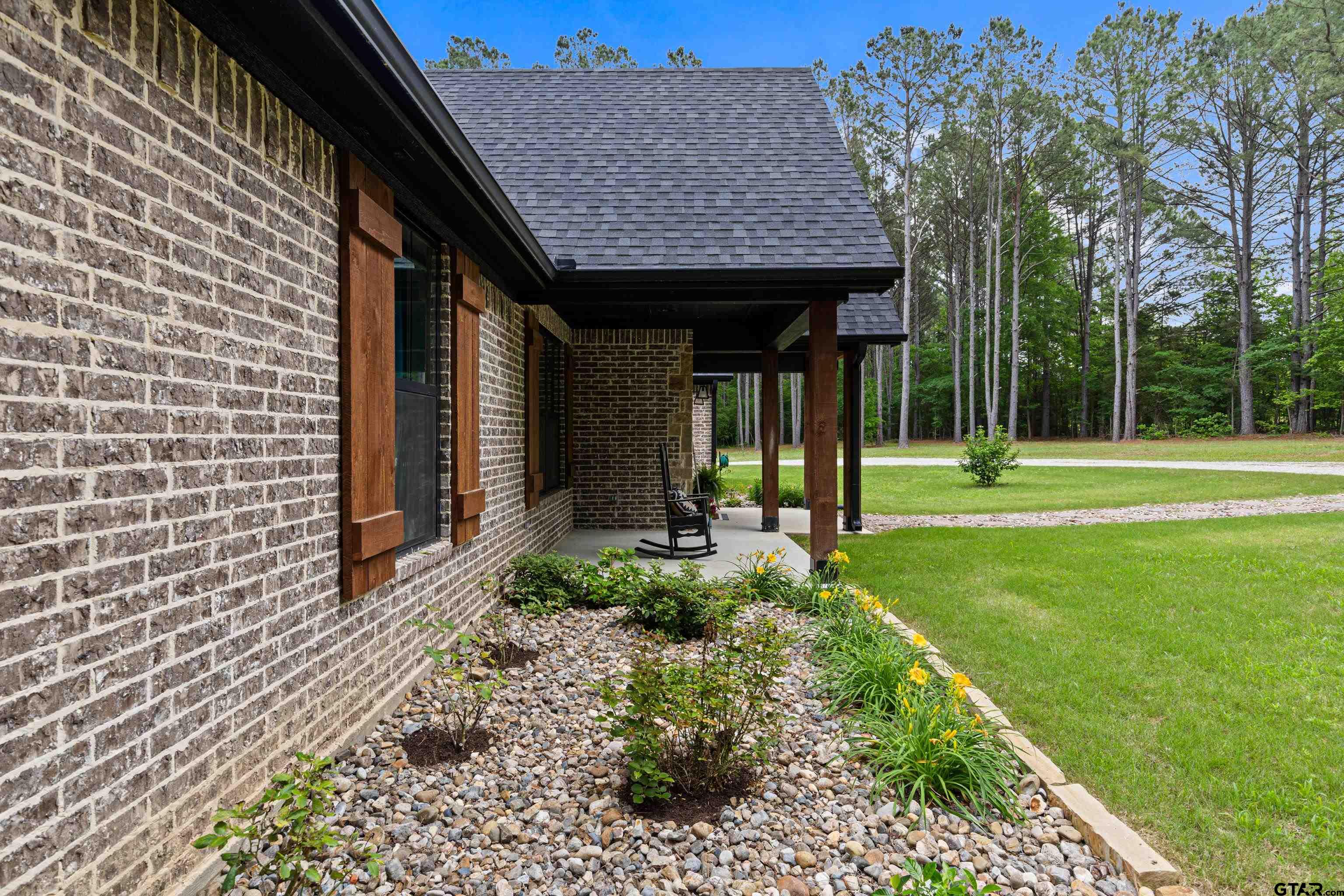 2505 Airstrip Road Gilmer, TX 75644 - Photo 36 of 37 a view of a back yard of the house
