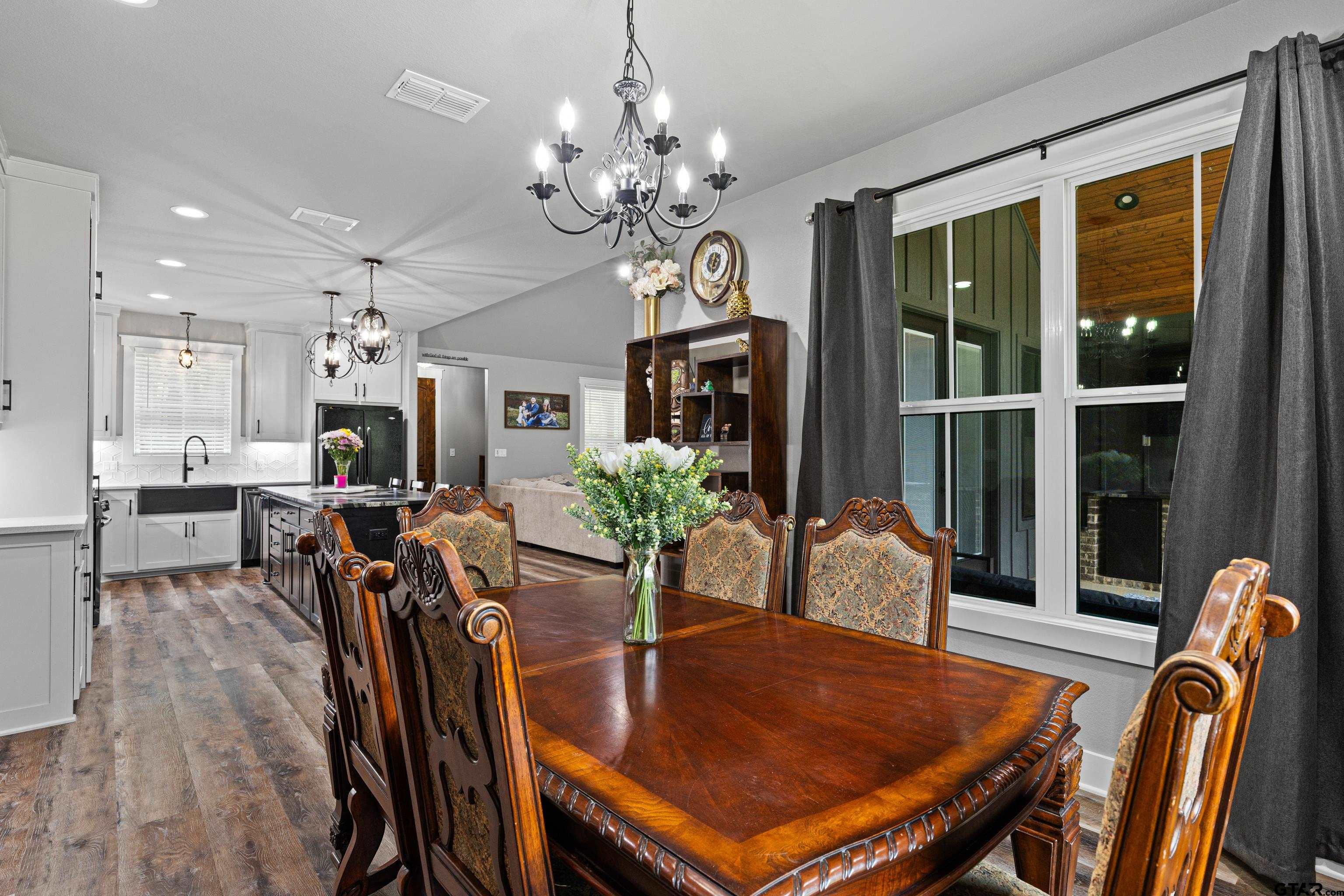 2505 Airstrip Road Gilmer, TX 75644 - Photo 8 of 37 a view of a dining room with furniture window and wooden floor