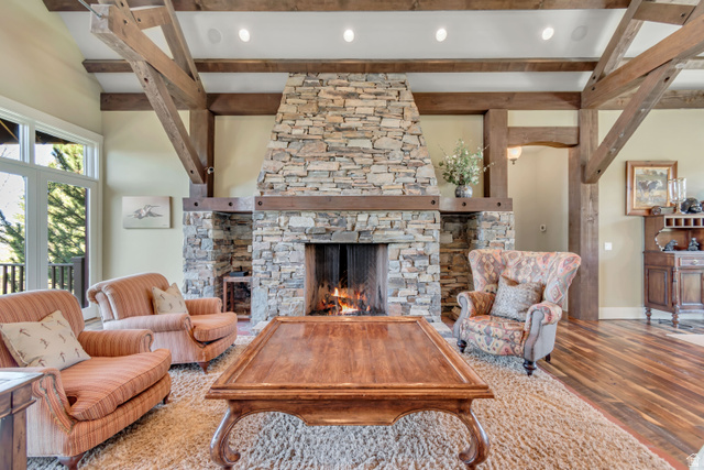 2579 Splendor Valley Road Kamas, UT 84036 - Photo 44 of 87 Living area featuring a fireplace, beam ceiling, wood finished floors, and recessed lighting