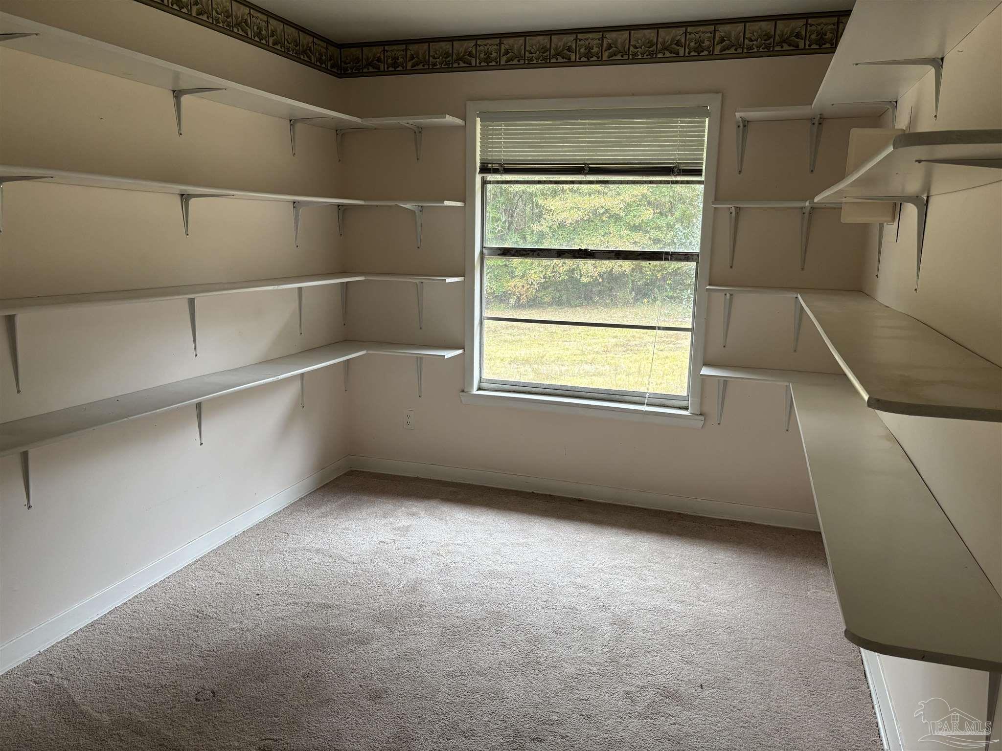 100 Brown Road McDavid, FL 32568 - Photo 14 of 20 a view of an empty room with a window