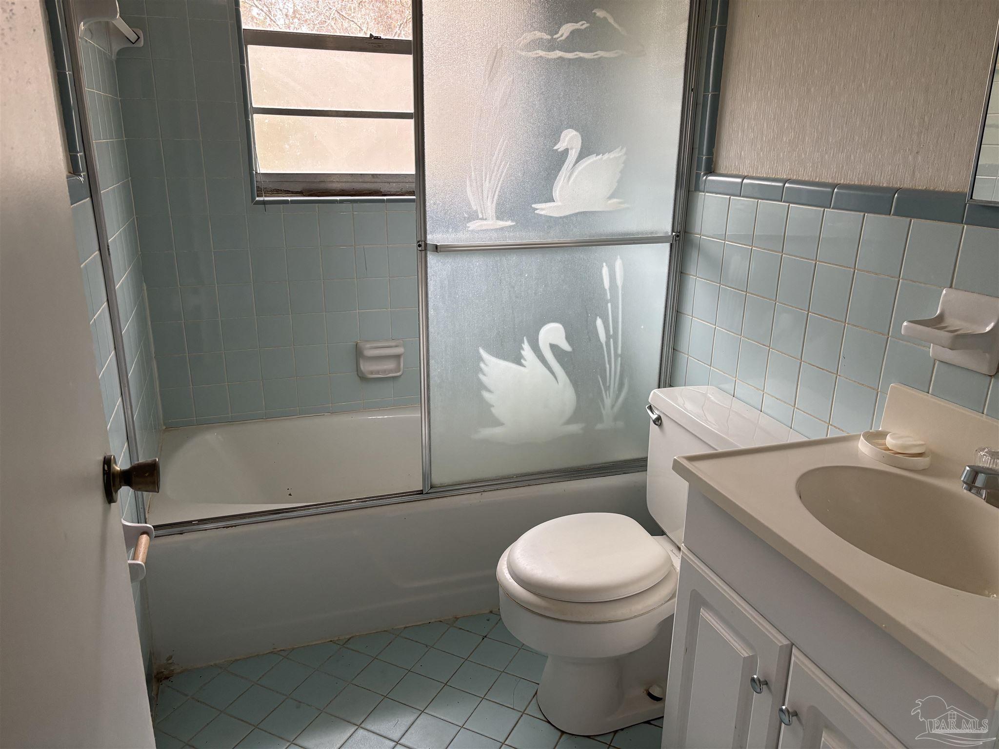 100 Brown Road McDavid, FL 32568 - Photo 19 of 20 a white toilet sitting next to a bathroom sink