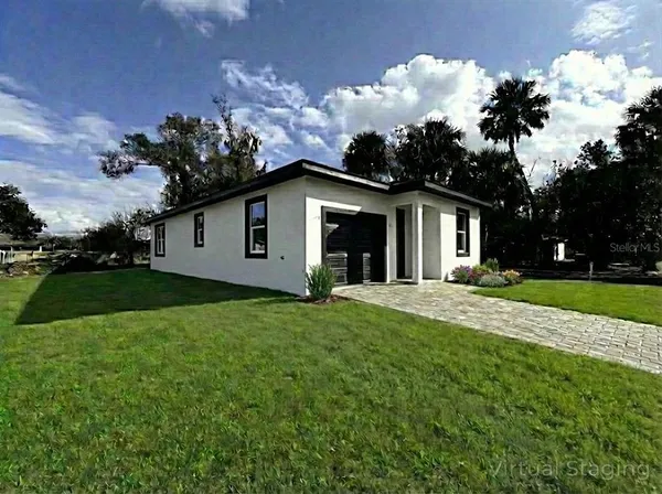 a view of a yard with a house and garden