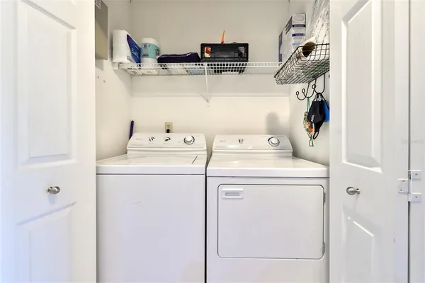 a utility room with dryer and washer